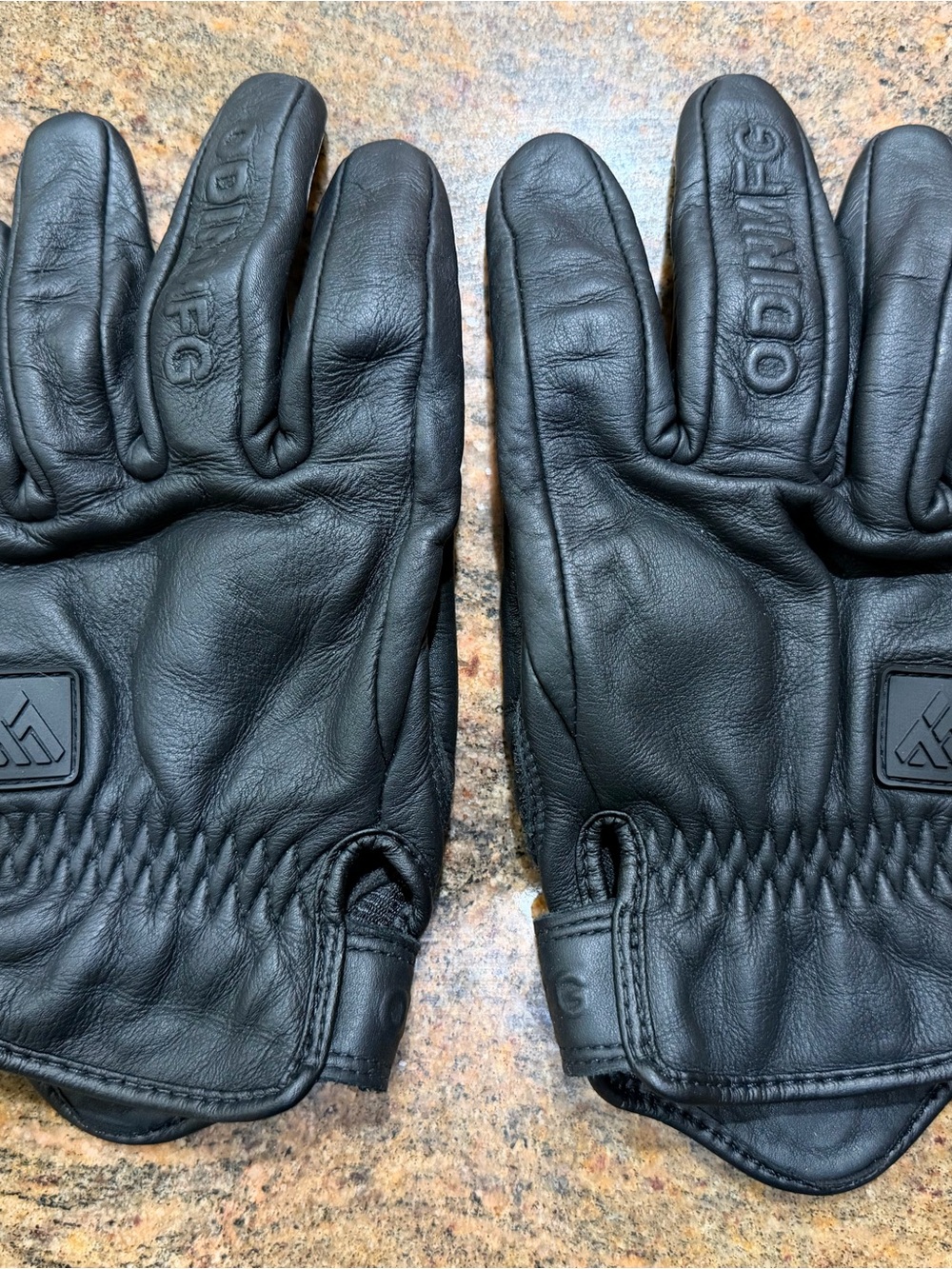 Black leather motorcycle gloves